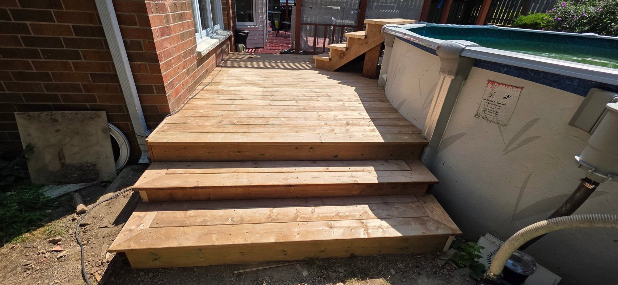 Poolside deck renewal by B&M Mourad Group Inc.