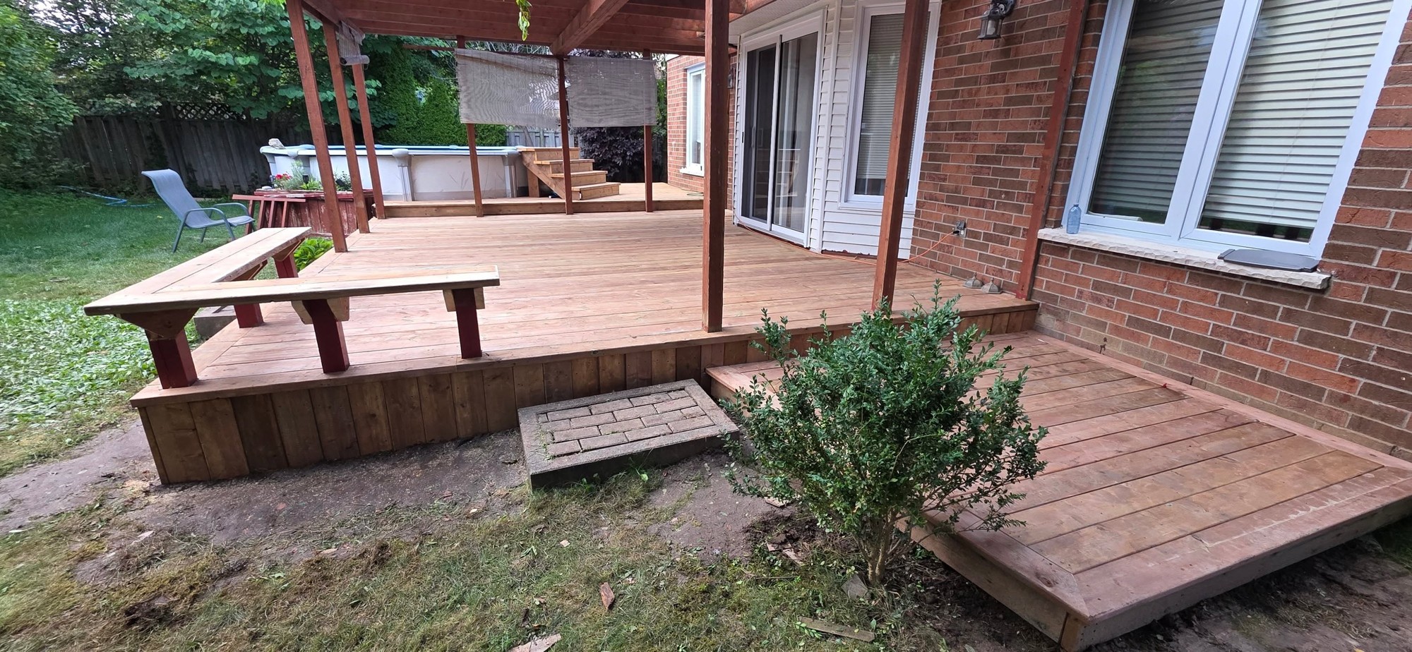 Deck with built-in seating by B&M Mourad Group Inc.